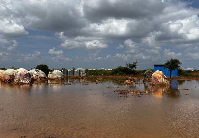 A camp for internally displaced people is inundated with flood water.