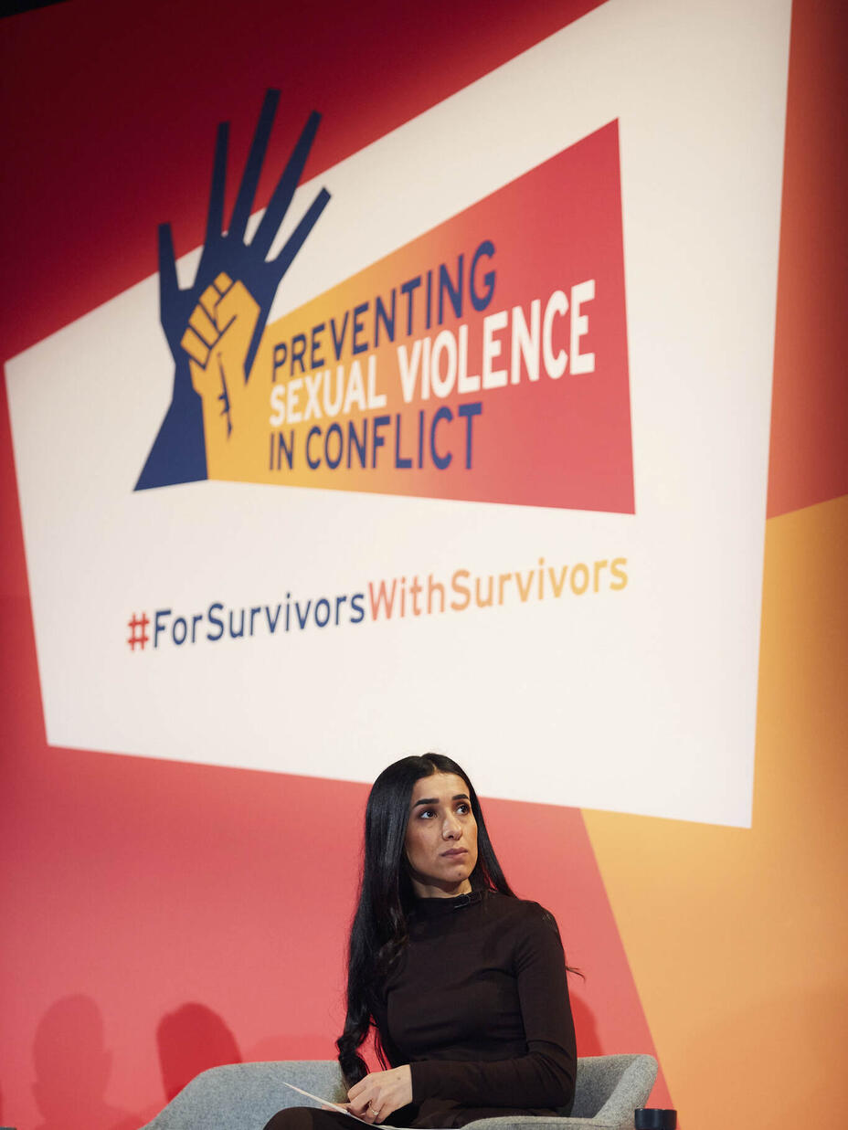 Nadia sat down, while giving a talk at a preventing violence in conflict event.