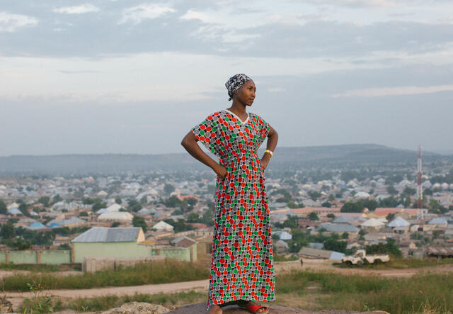 A woman stoically poses for a portrait while she overlooks the city of Yola, Nigeria.