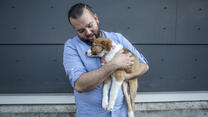 Suamhirs Piraino-Guzman with his dog, Lilly, outside his home in Seattle