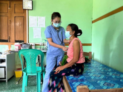 A medical staff of KBC is examining a patient at the Ziun clinic in Myitkyina in Kachin State