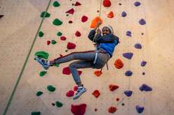 Refugee youth enjoys climbing.