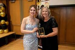 Kathy Bittinger (right) accepting the Humanitarian Award from IRC staff  Michalina Kulesza (left) 