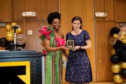 Kerry Brodie (right) being presented with the Advocate Award by IRC staff Mimi Matala (left) 