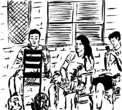 Newcomer family sits on the porch of their new home