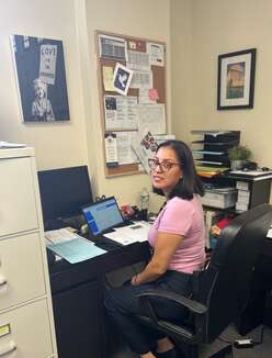 Milagros, the Legal Representative at IRC NJ, prepares for an upcoming Naturalization Application client consultation. 