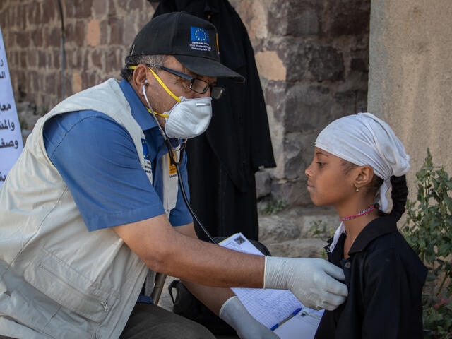 Aisha receiving primary healthcare from IRC staff