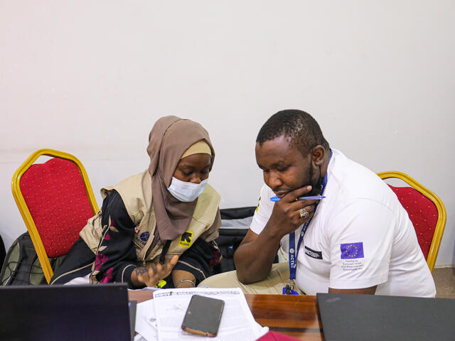 Man and woman sitting together to discuss