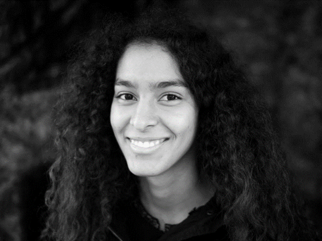 A black and white photo of a woman with long hair