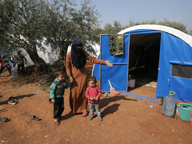 A Syrian mother with her small children