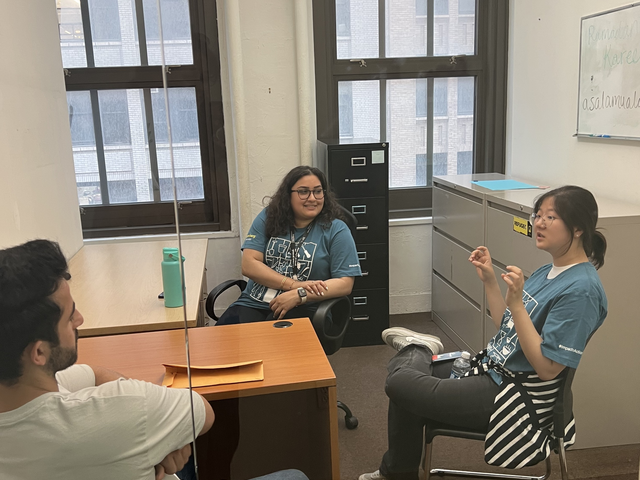 Bloomberg Volunteers and Workshop Participant Discussing Networking