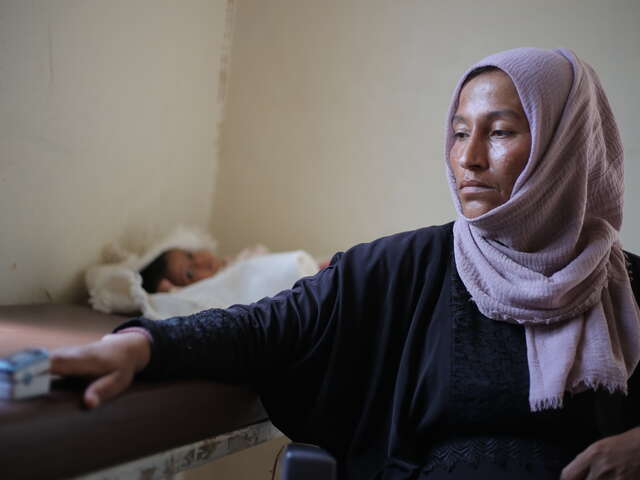 Widad completes a medical screening at the IRC health centre.