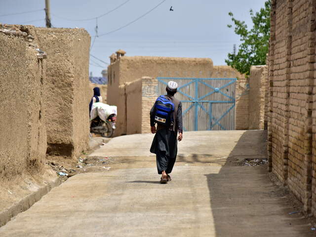 Naiko on his way to the Government Boys Middle School in his village after successfully completing the IRC's Accelerated Learning Program (ALP).