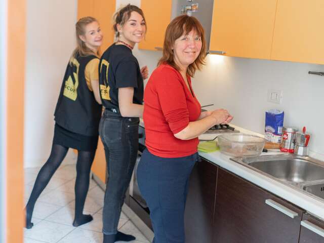 Luibov cooking borscht with IRC staff in Milan, Italy