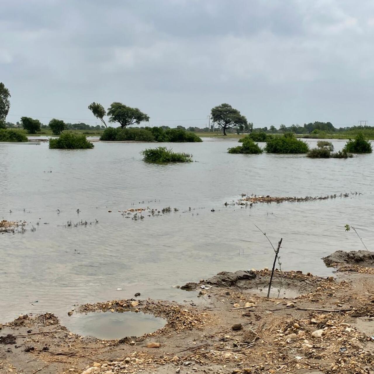 A road is completely submerged in water.