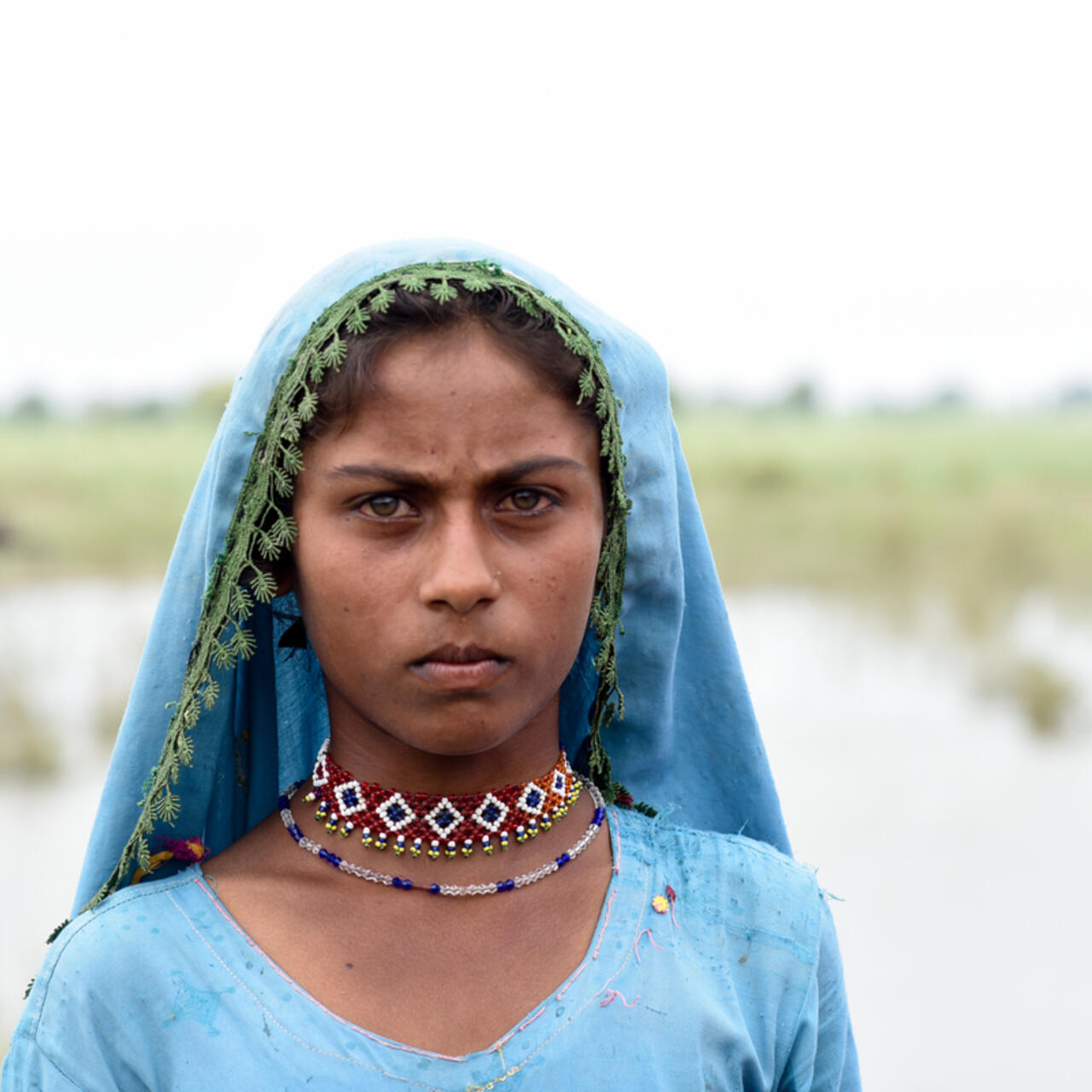 A young girl is seen in her culture attire during the flood emergency in Sindh, Pakistan