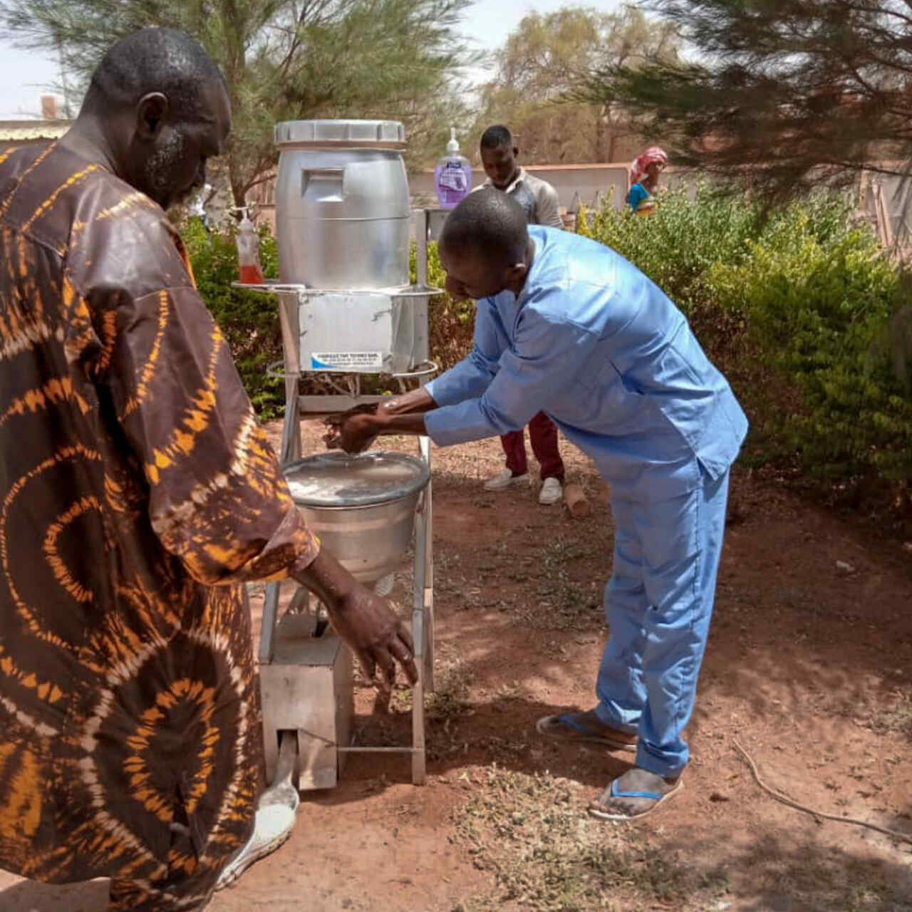 Health workers, with IRC support, screen for symptoms of coronavirus at a health center in Djibo, Burkina Faso.