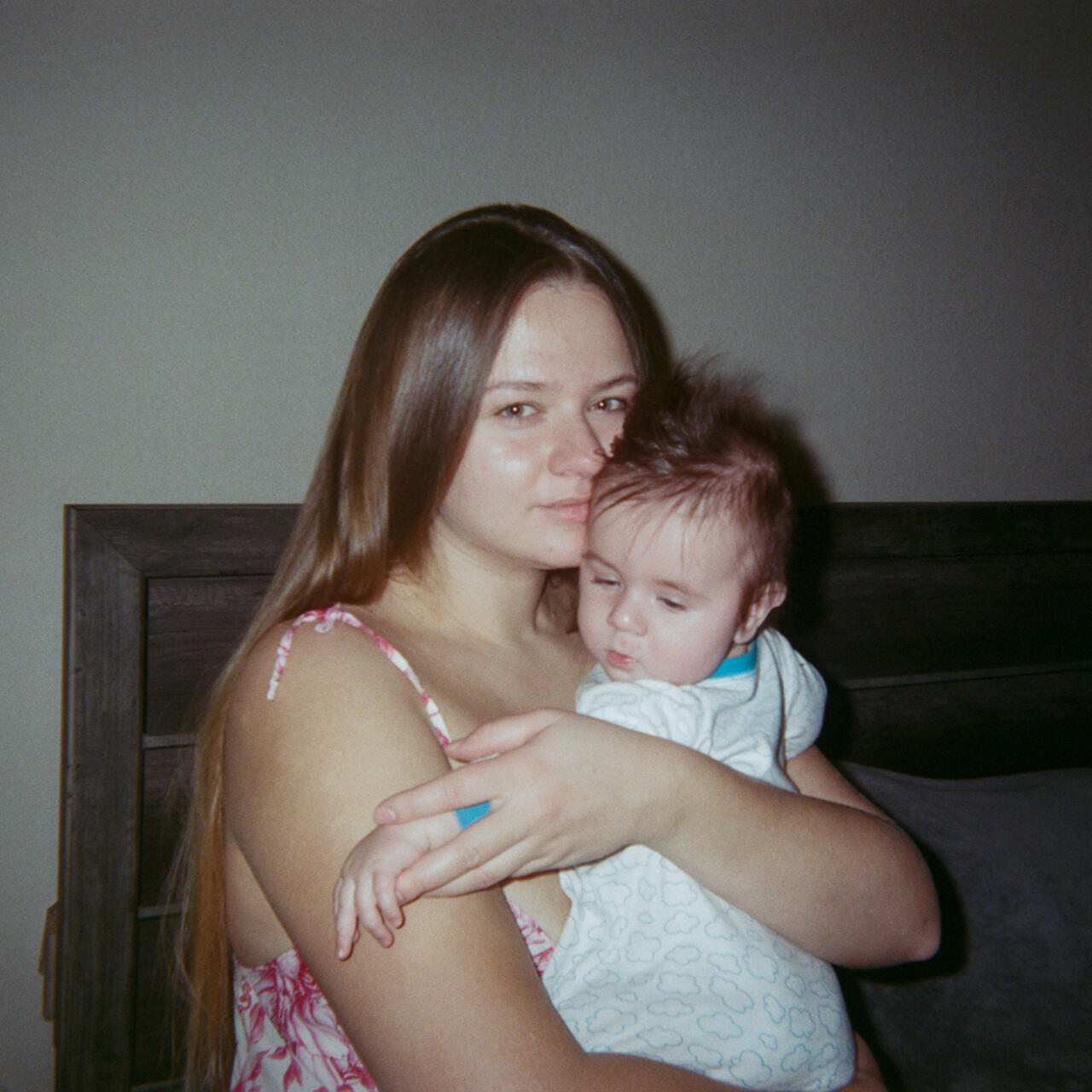 Olexandra holds baby Michael in her arms, facing the camera.