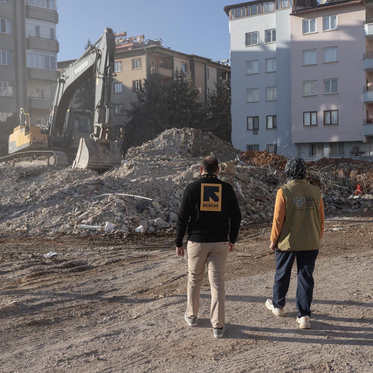 IRC staff amongst the rubble.