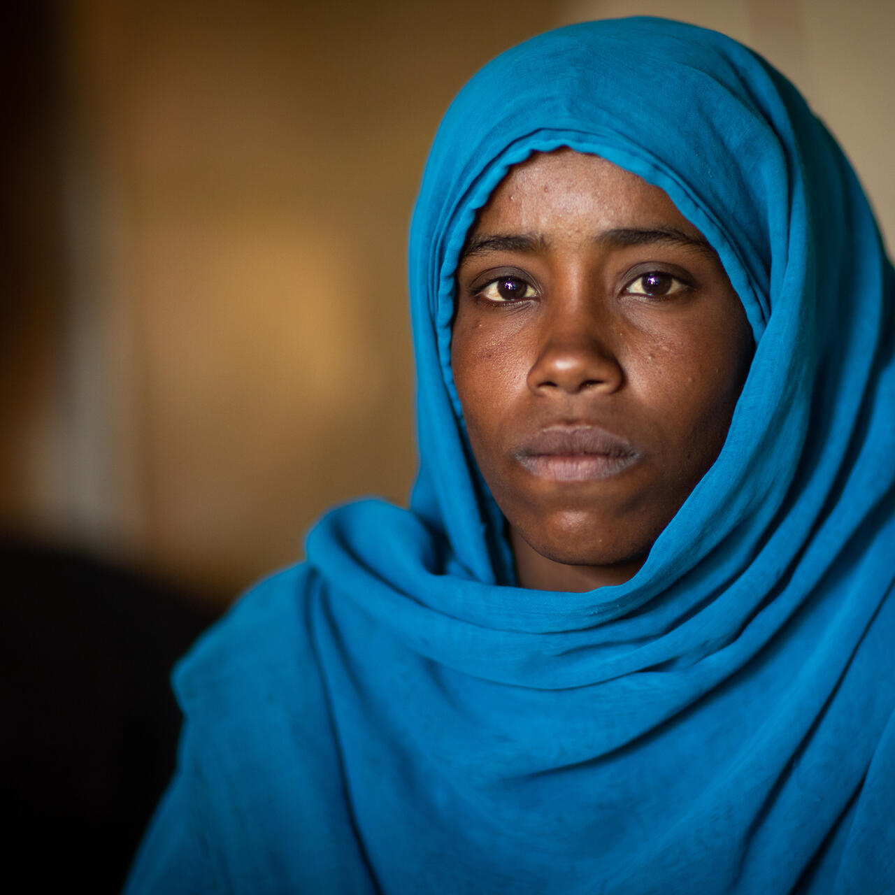 A woman from the Beja tribe woman in Port Sudan, the capital of the Red Sea State in eastern Sudan, poses for a portrait. 