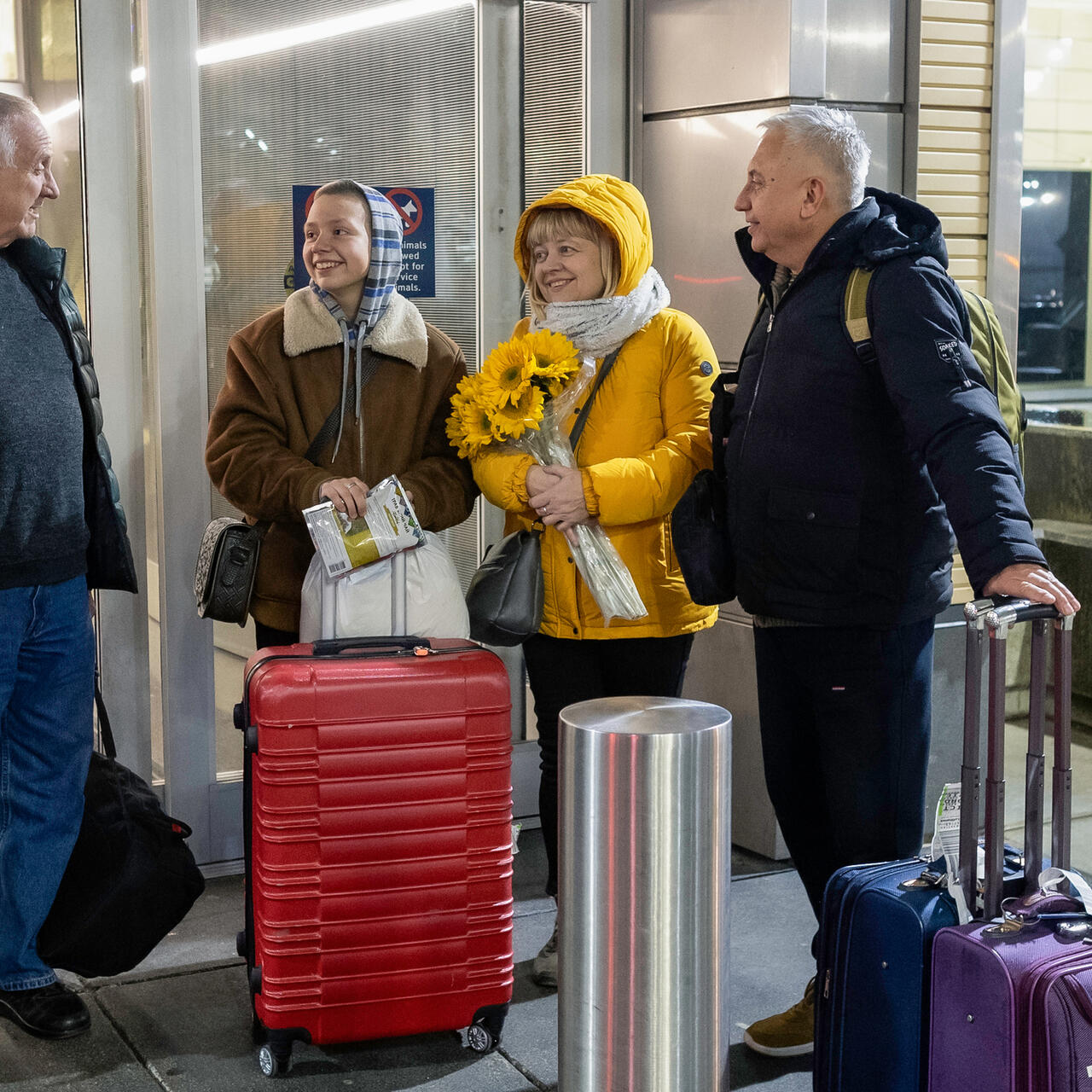 The Plegutsa family arrive at the airport in Kansas