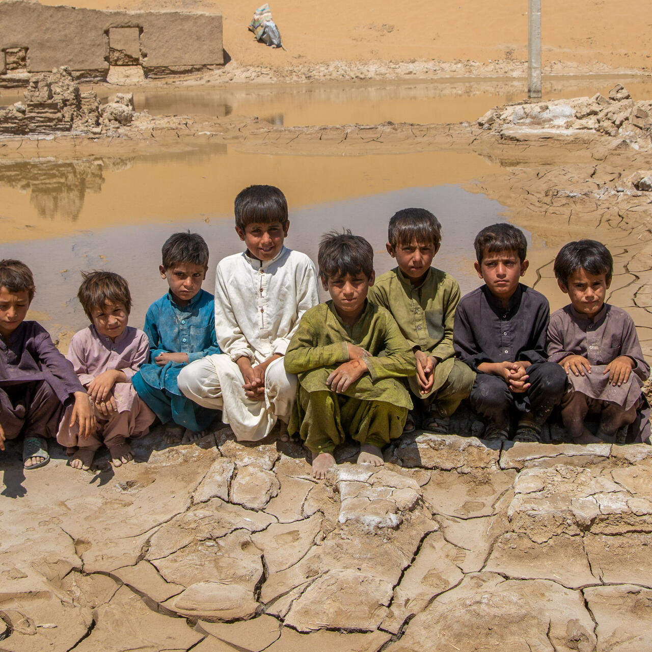 A group of boys sit together in Pakistan