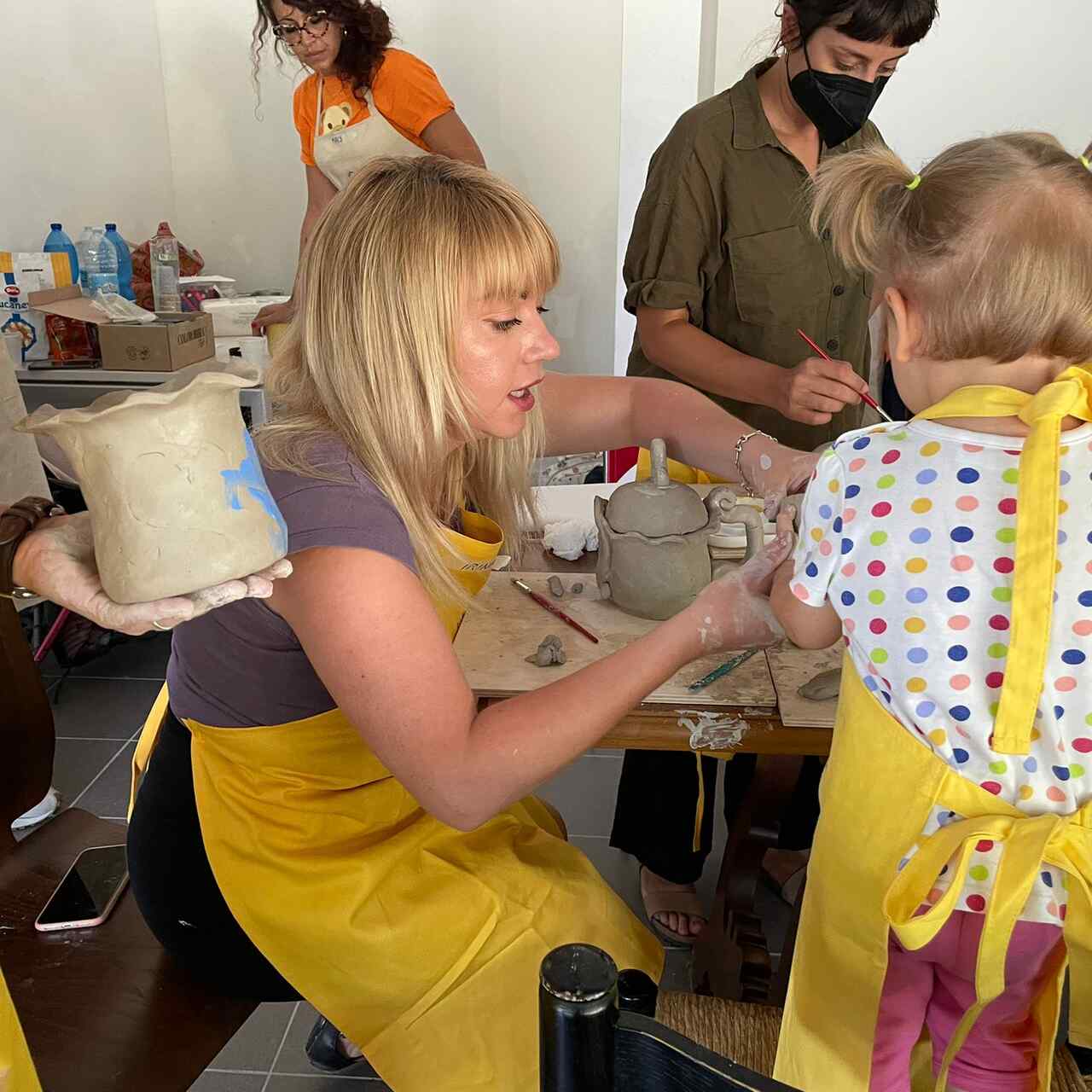 Ukrainian women and girls take part in a pottery class in a Women and Girls Safe space in Milan, Italy.