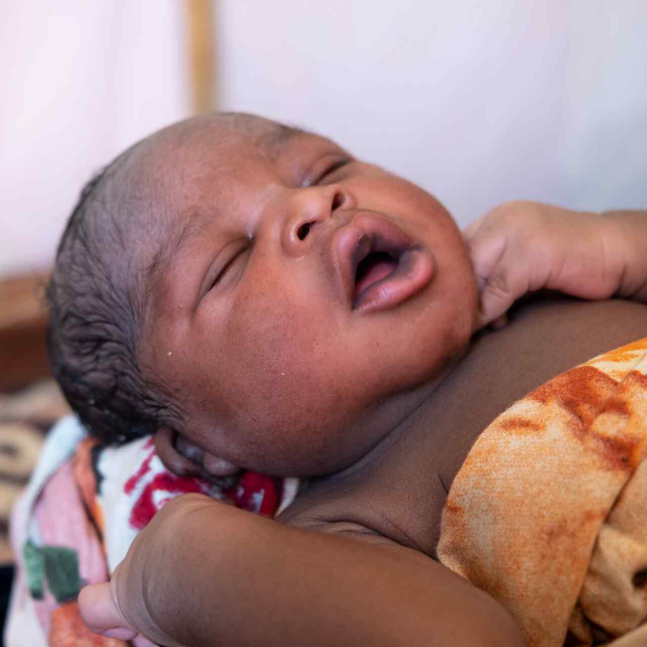 30 May 2023. Gaga refugee camp, Chad. Raouda’s baby, Abdelrahim, is born a few hours earlier in the IRC's health center.