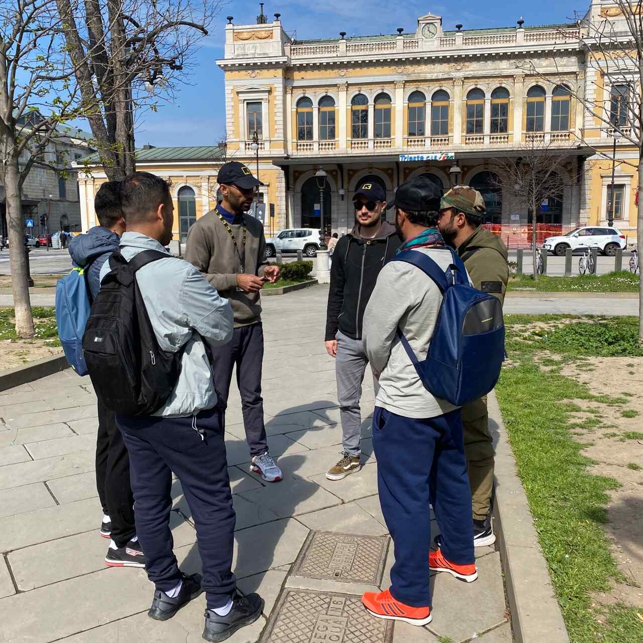 IRC staff provide information to young people at Trieste Central Station.