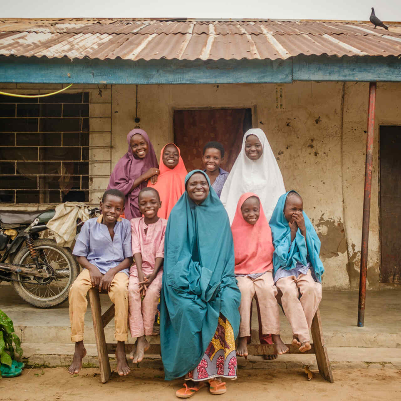 Portrait of Faiza Habibu(60) and her family in her home in Dasin Hausa community, Adamawa State Nigeria.