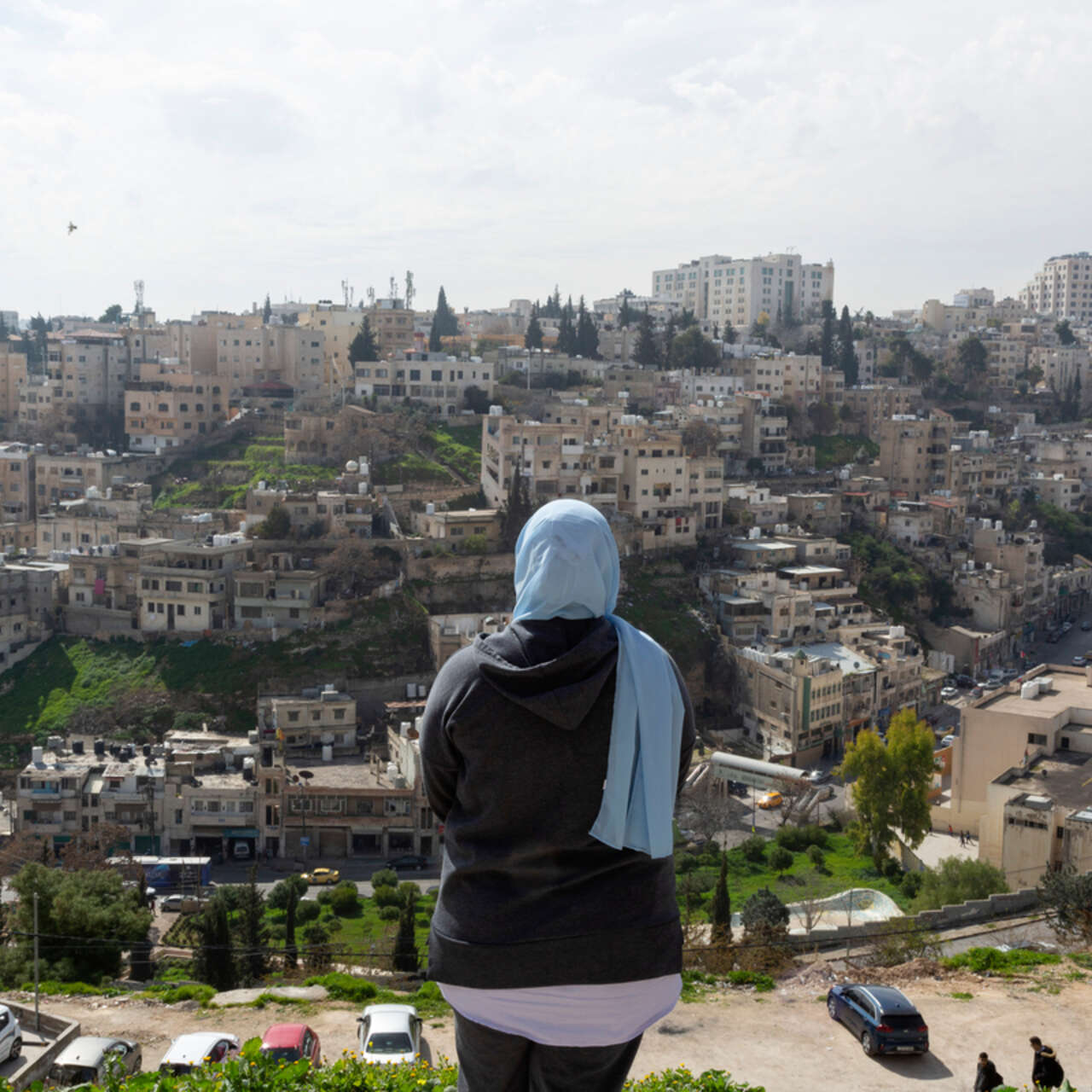 Hamida, 26, looks at the city of Aman.