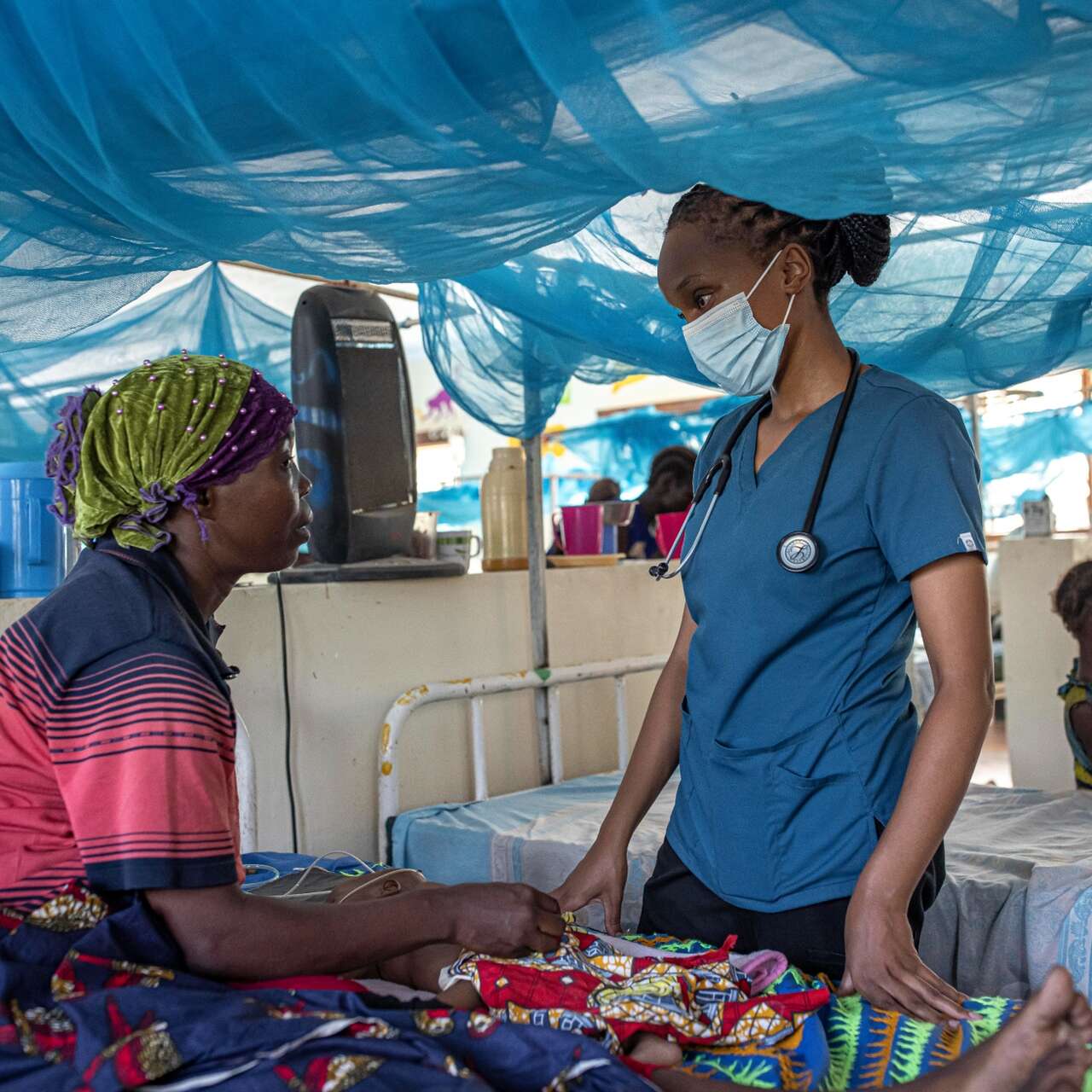 A IRC malnutrition officer consults a patient at a health center in Kenya.