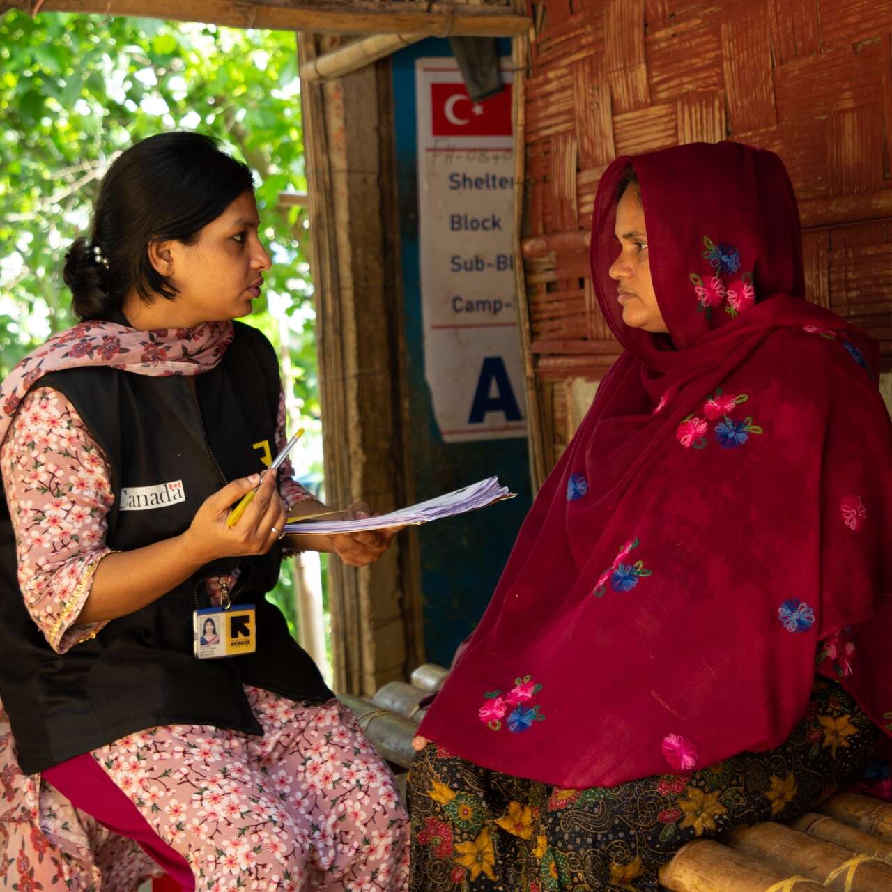 An IRC staff member consults a Rohingya refugee in Bangladesh.