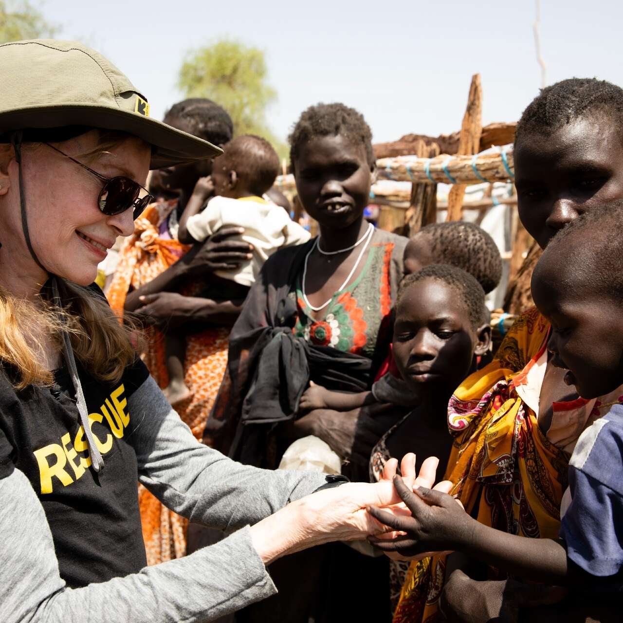 Mia Farrow with families in a village in in South Sudan with charity IRC.