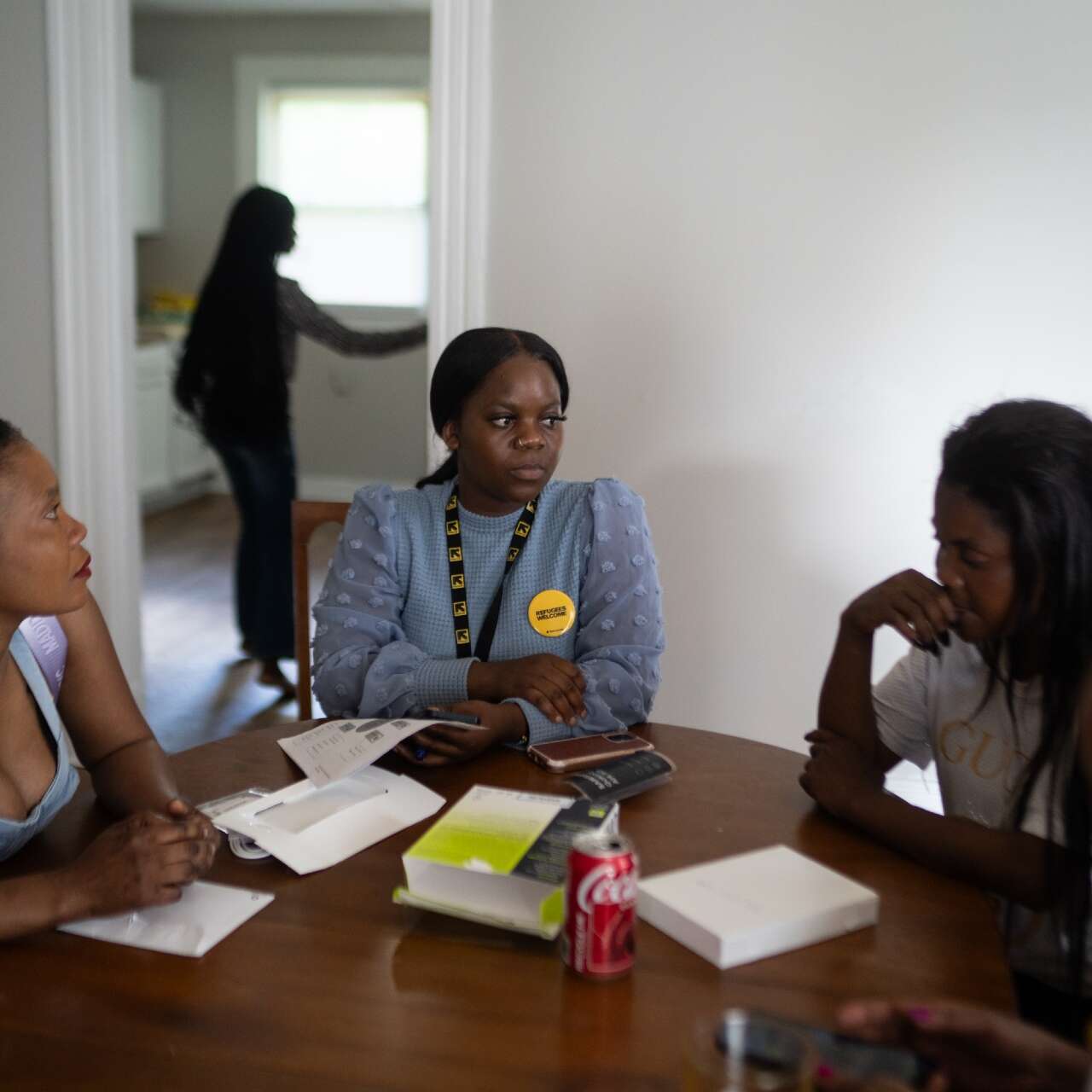 The Welo family meets with an IRC caseworker at their new home in Louisville, Kentucky.