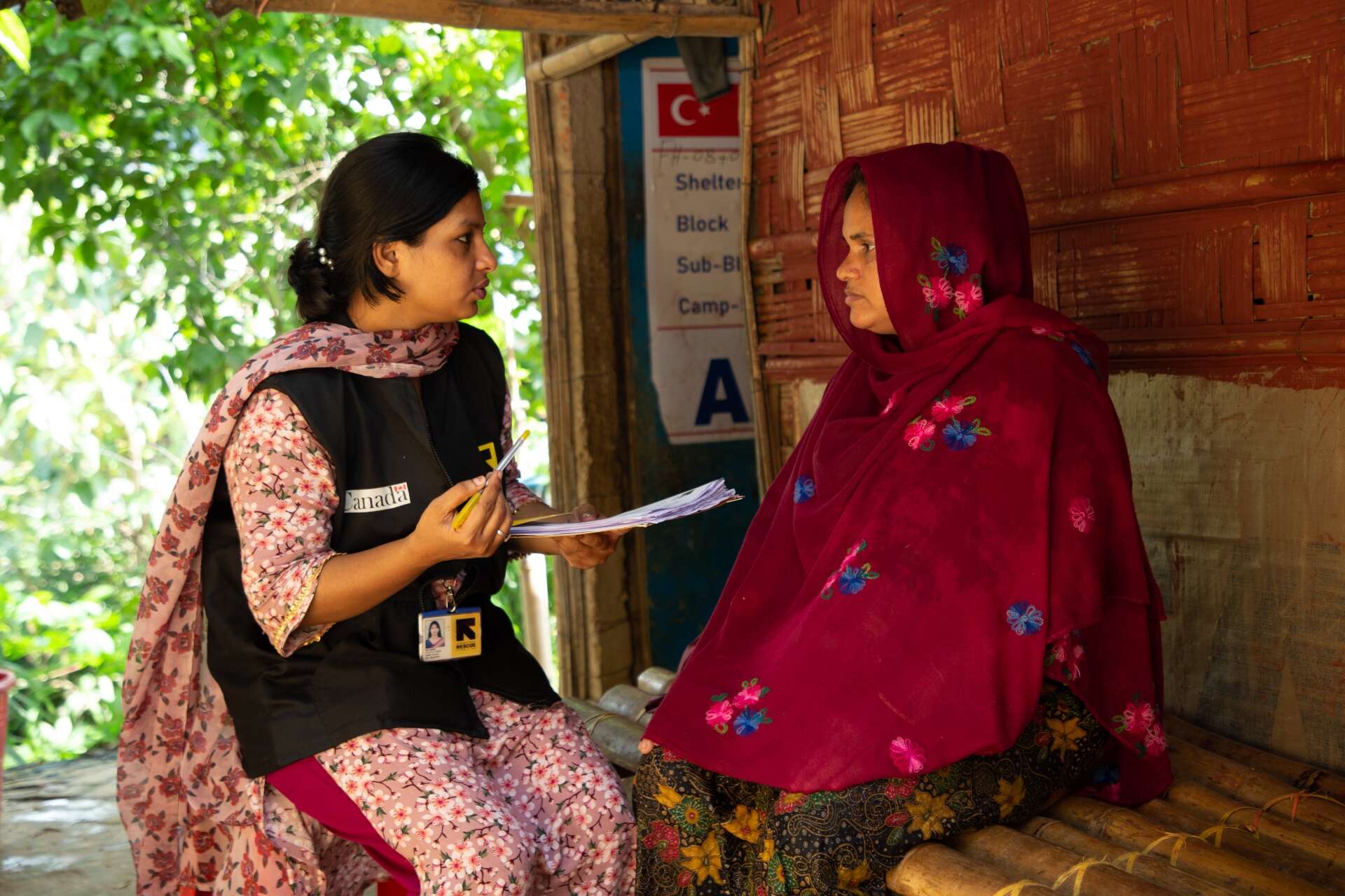 An IRC staff member consults a Rohingya refugee in Bangladesh.