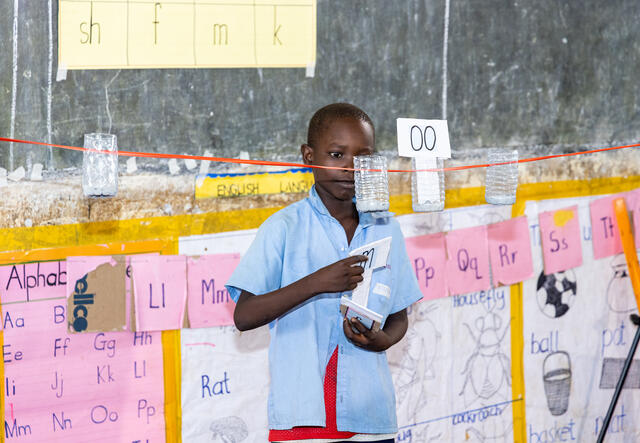 A young boy leads a class room activity in a PlayMatters program.