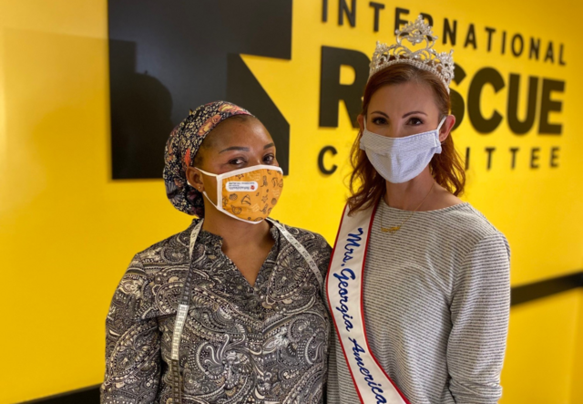 Olga (left) and Darcy (right) smiling for the camera in the IRC Atlanta reception area.