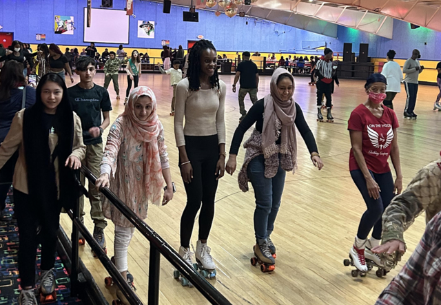 A group of youth roller skating