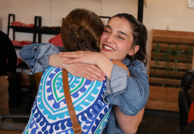 A Youth Futures student hugging Student Support Specialist Brynn Walker