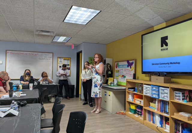 Katya Galytska, Ukrainian Caseworker, addresses the group.