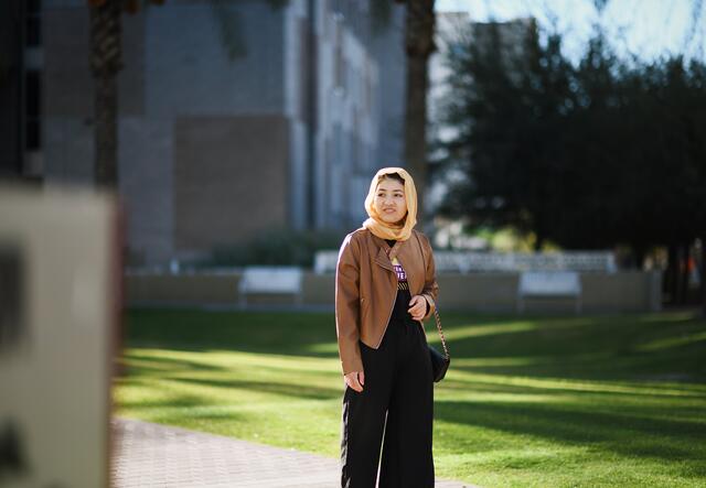 Mansora, an ASU scholar from Afghanistan, walks around campus.