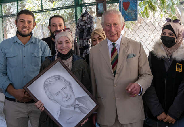 Huthaifa (left) when King Charles III, then HRH The Prince of Wales, visited the IRC in Jordan in 2022.