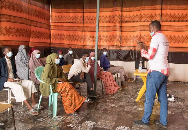 Abdinur, 28, a community management officer, provides a training on the IRC's simplified approach to treating moderate and severe acute malnutrition in children.