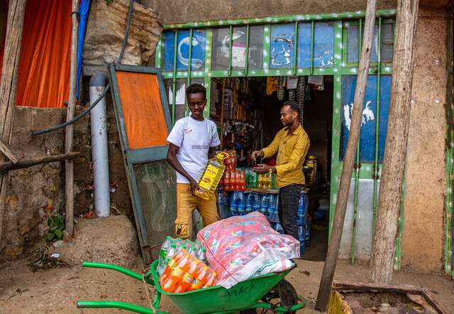 Shurki Ahmed works as a laborer in Ethiopia. He transports store supplies between stores in a rented wheelbarrow. 