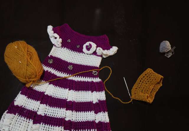 A purple and white children's dress.