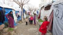 Children gather in an IDP camp in northeast Syria.