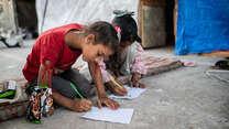 Children drawing as part of a psychosocial support activity held by IRC partner Nafs.