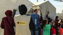 An IRC staff member stands outside an IRC-run psychosocial session for children in Gaza.