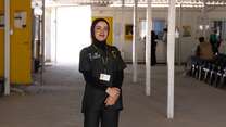 Duha, an IRC nurse, poses proudly at an IRC-run health care facility in the Za'atari refugee camp.